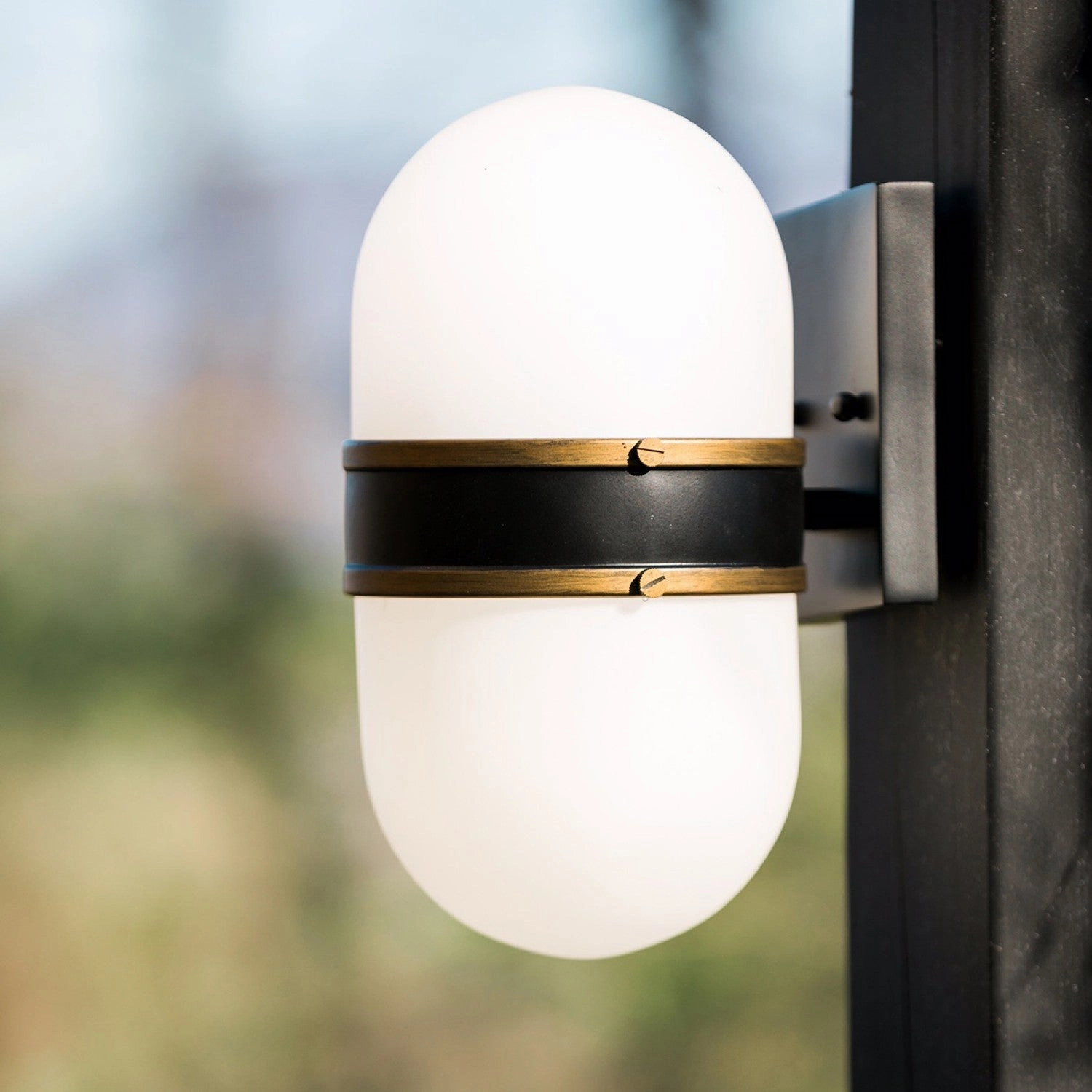 Capsule One Light Outdoor Wall Sconce Matte Black   Textured Gold
