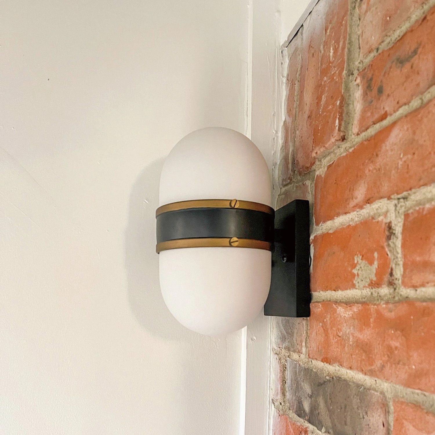 Capsule One Light Outdoor Wall Sconce Matte Black   Textured Gold