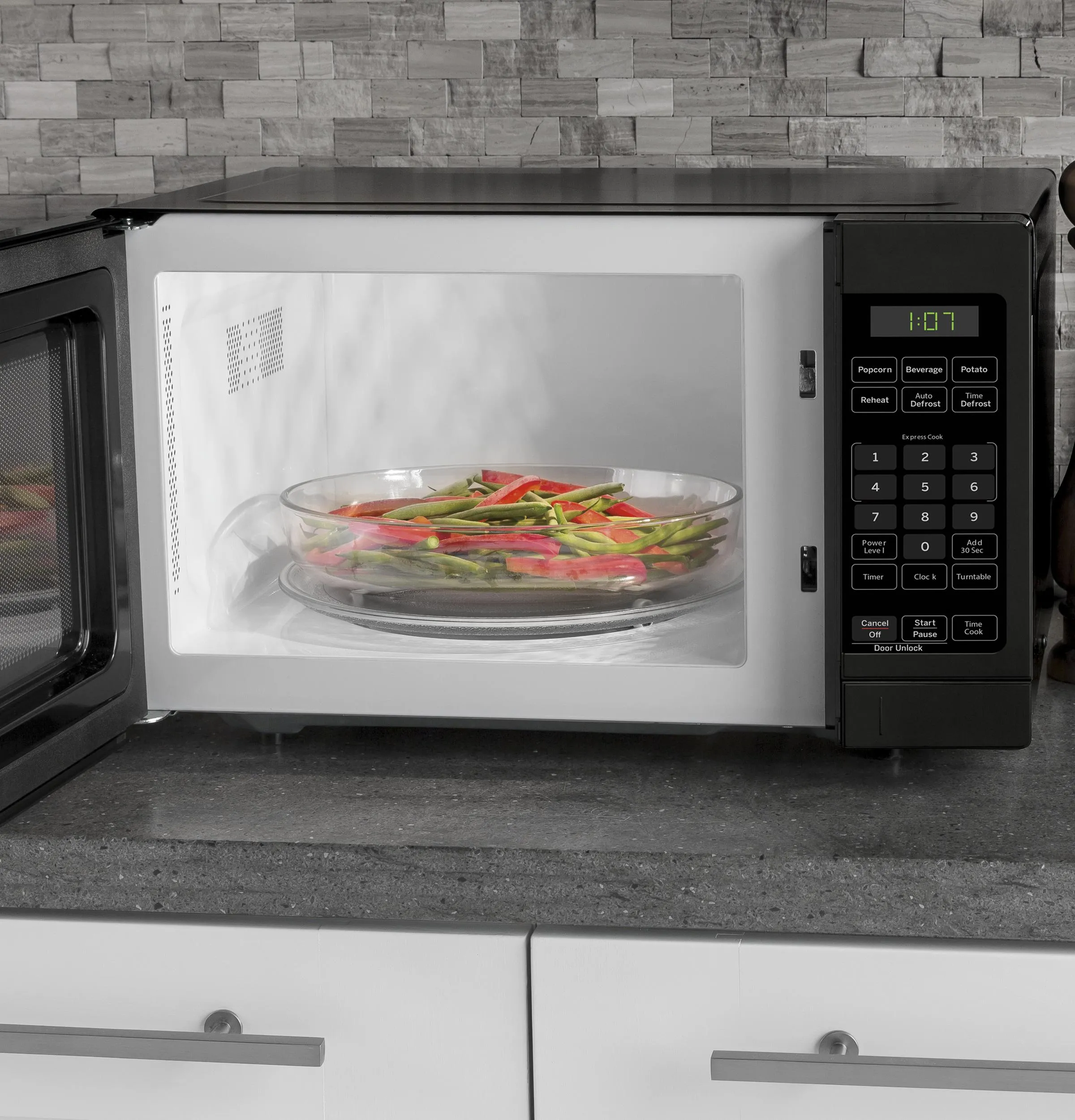 Ge Appliances GCHK07N1WBB Ge? 0.7 Cu. Ft. Spacemaker? Countertop Microwave Oven